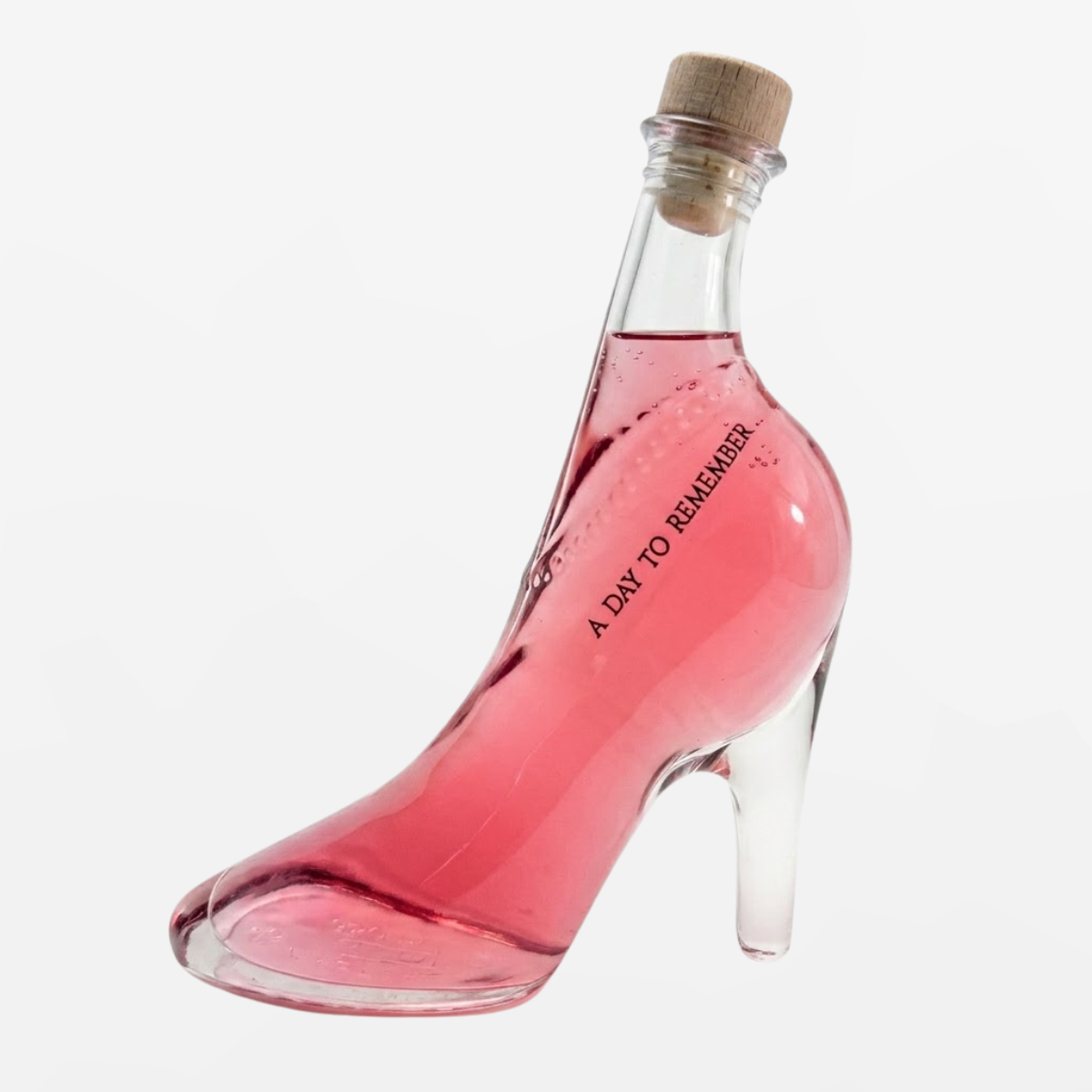Flaschengeist Stiletto Birthday Gift — bold, fashion-forward handcrafted glass stiletto heel bottle filled with premium spirits, front-facing hero shot on cream background
